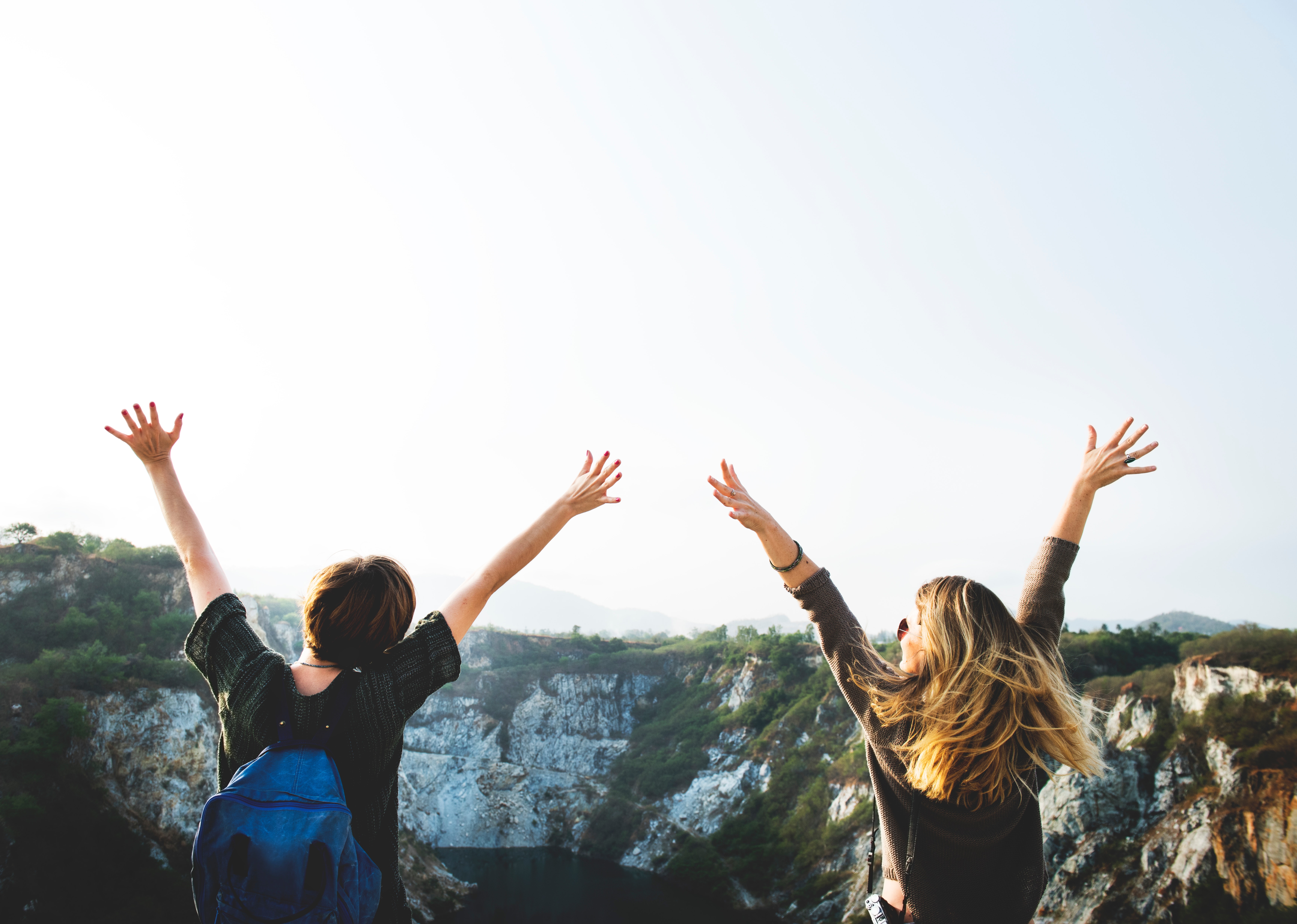 two-women-holding-hands-mountains